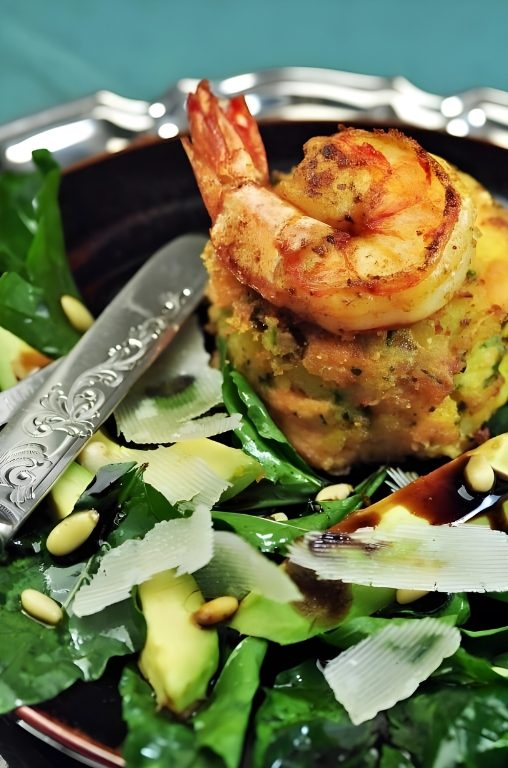 Prawn on a crisp cake, with avocado and Parmesan