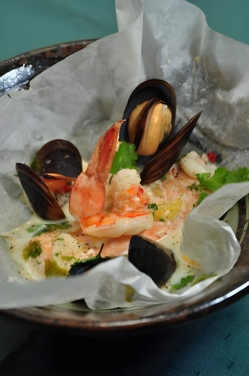 Seafood cooked in paper