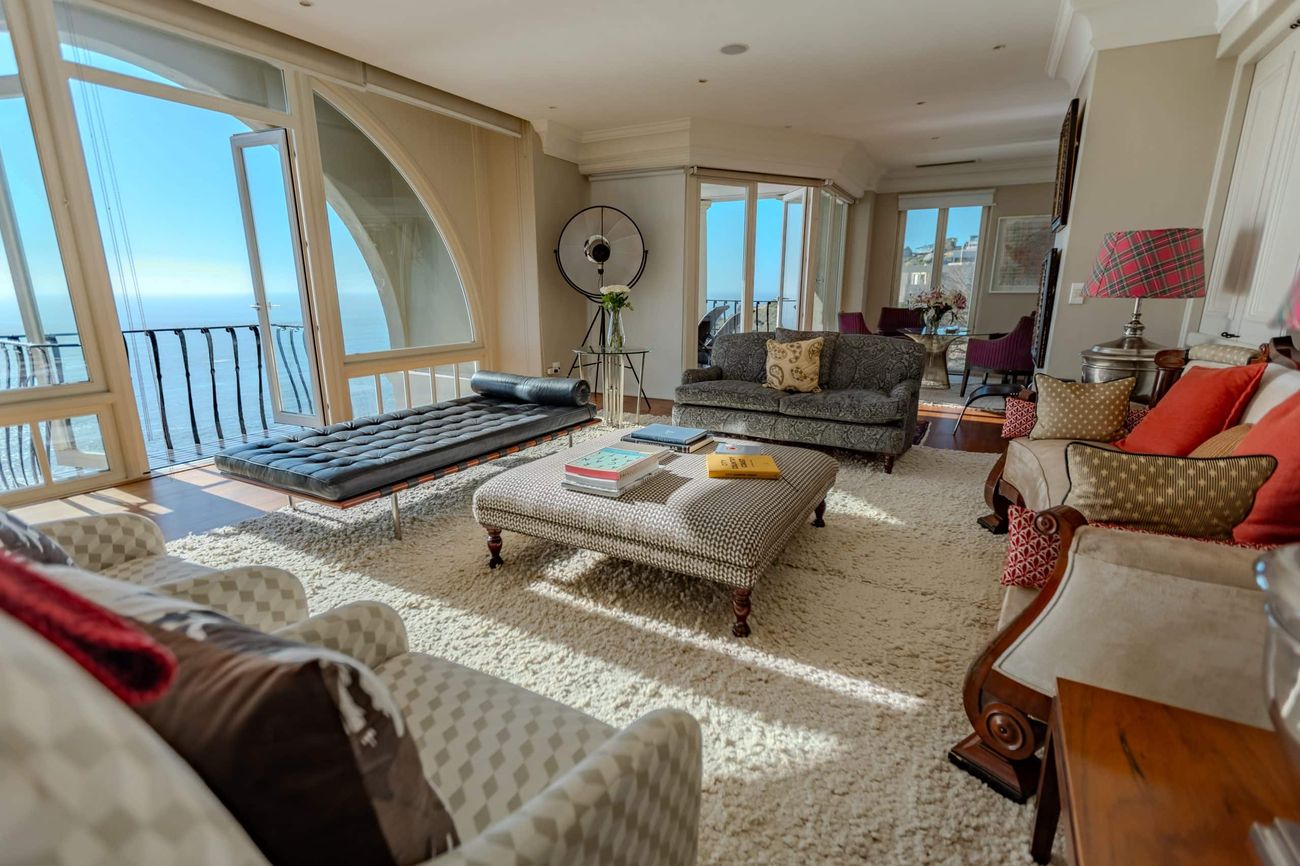 The living room of the Penthouse, with arched windows onto the Atlantic