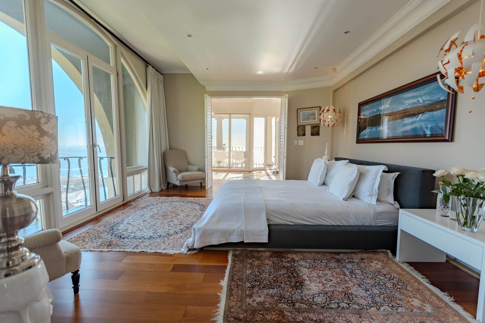 The bedroom of the Penthouse, opening onto its own terrace