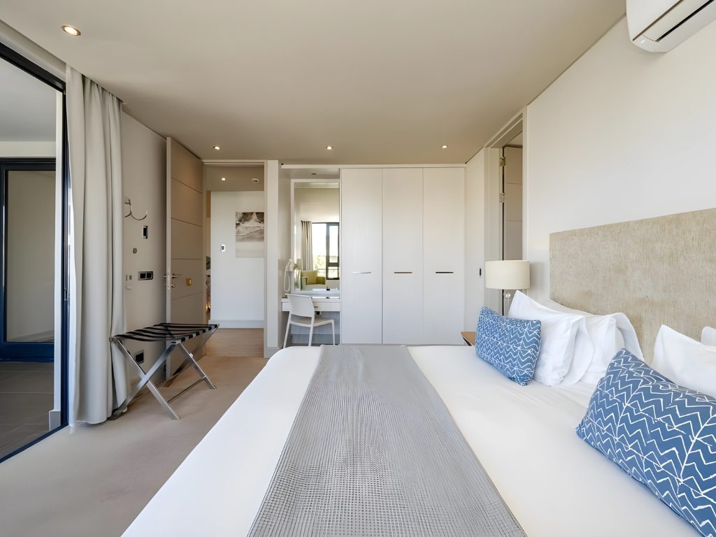 A calm modern bedroom in white and blue