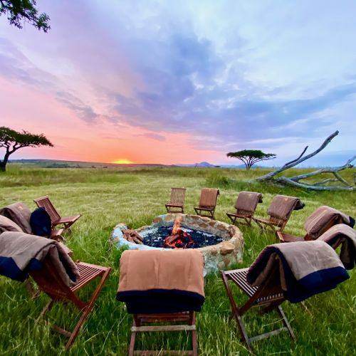 Round the fire as the sun goes down