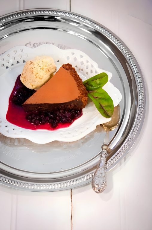 Chocolate tart with berries and ice cream