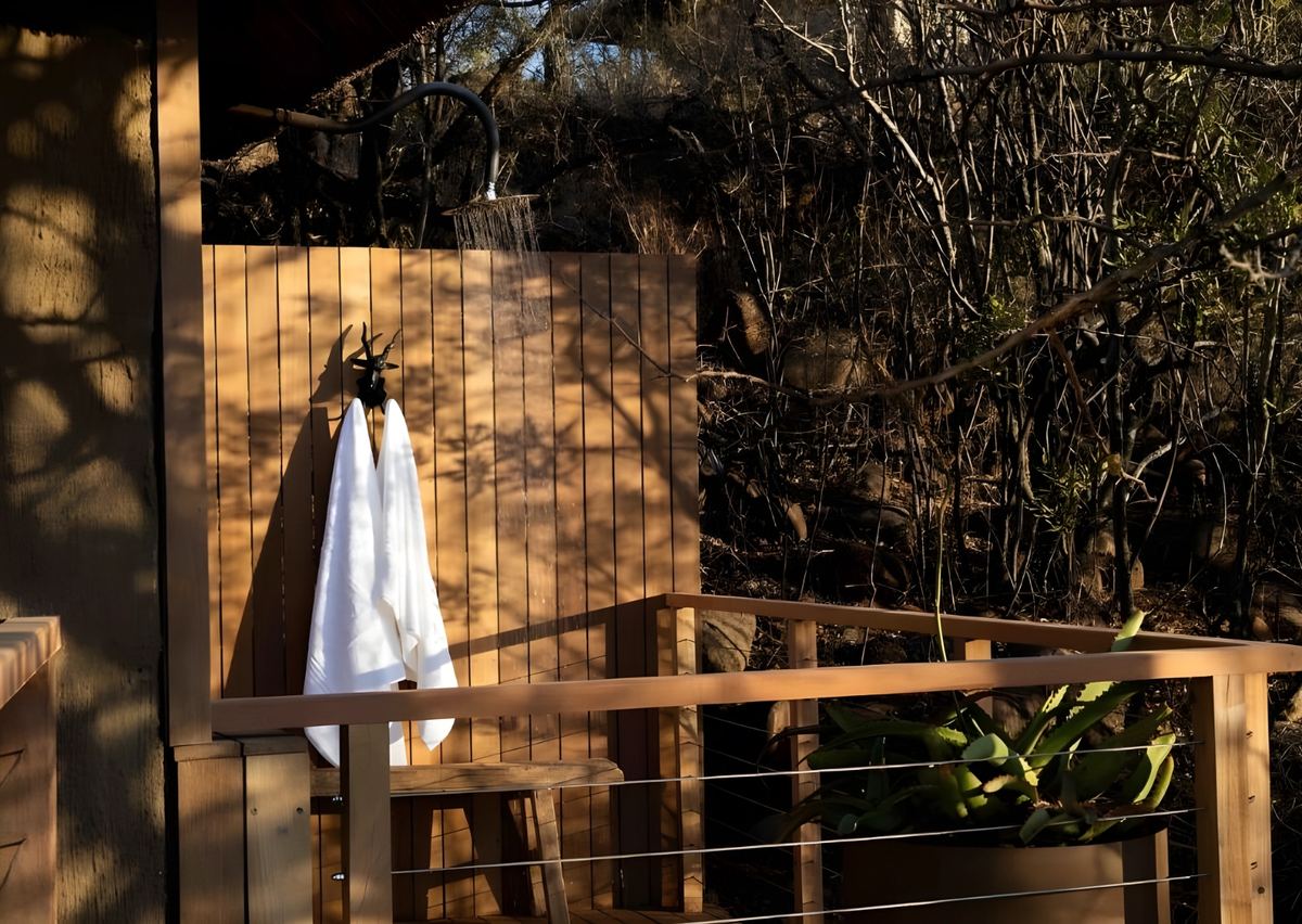 The honeymoon suite outdoor shower among the trees